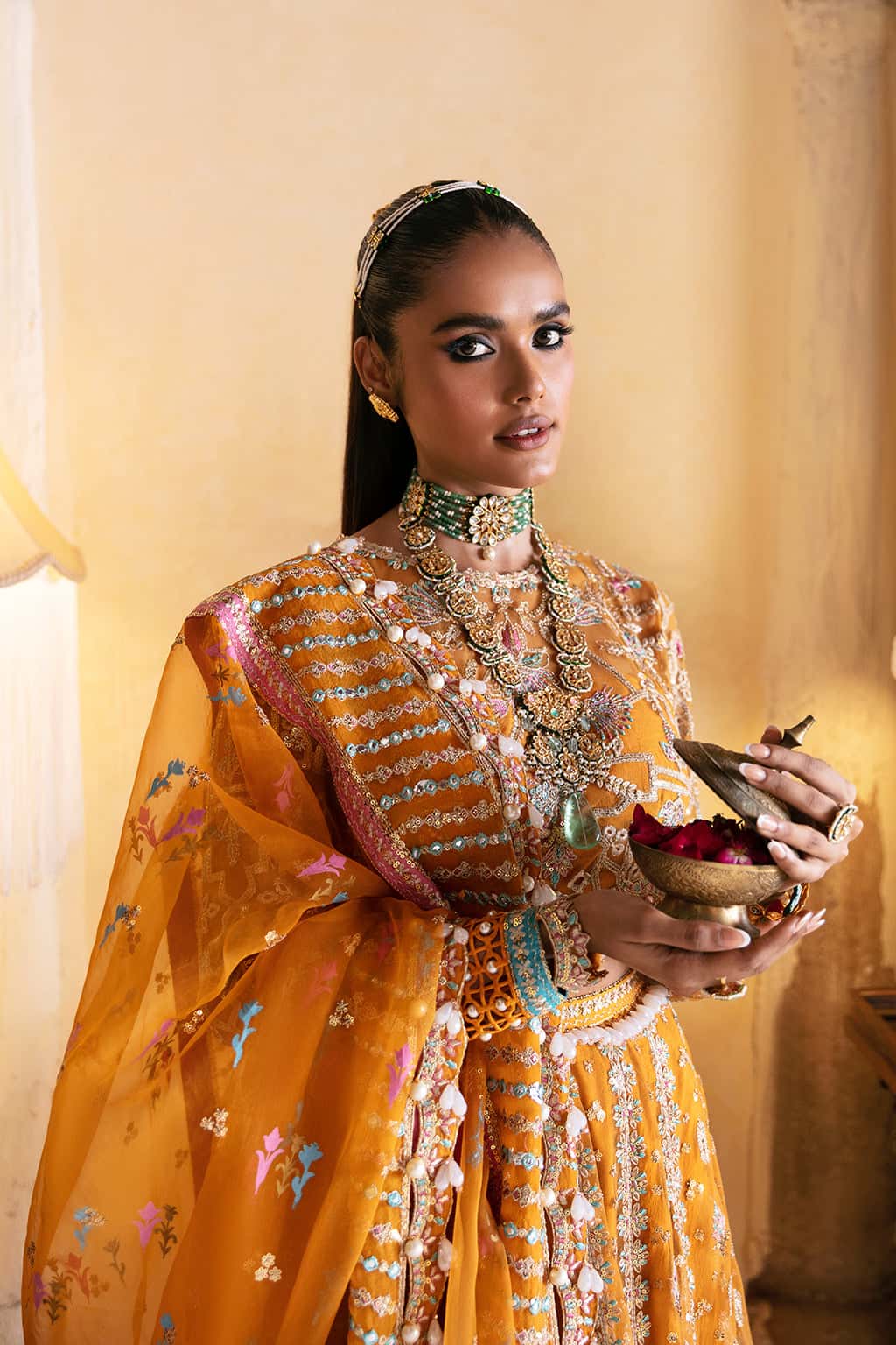 Mahnoor Sabir wearing Afrozeh Kamila mustard yellow embroidered organza lehenga choli for Pakistani Mehndi and Mayun celebrations