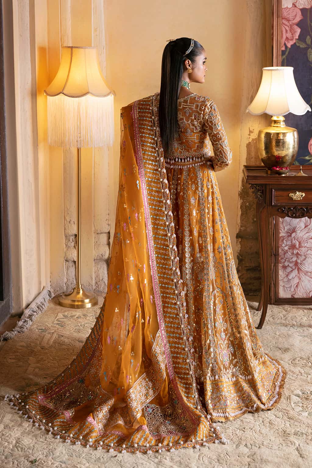 Afrozeh Kamila matching marigold gold organza dupatta with delicate embroidery styled with a traditional Pakistani lehenga choli