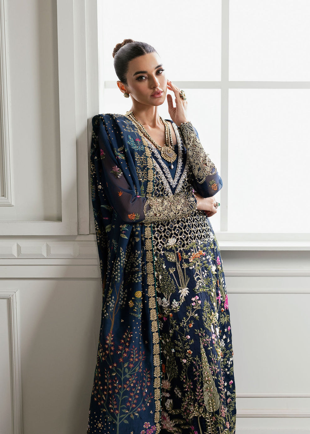 Close-up of intricate multicolour floral embroidery and antique gold ornamental detailing on Crimson Majestic Cypress formal dress