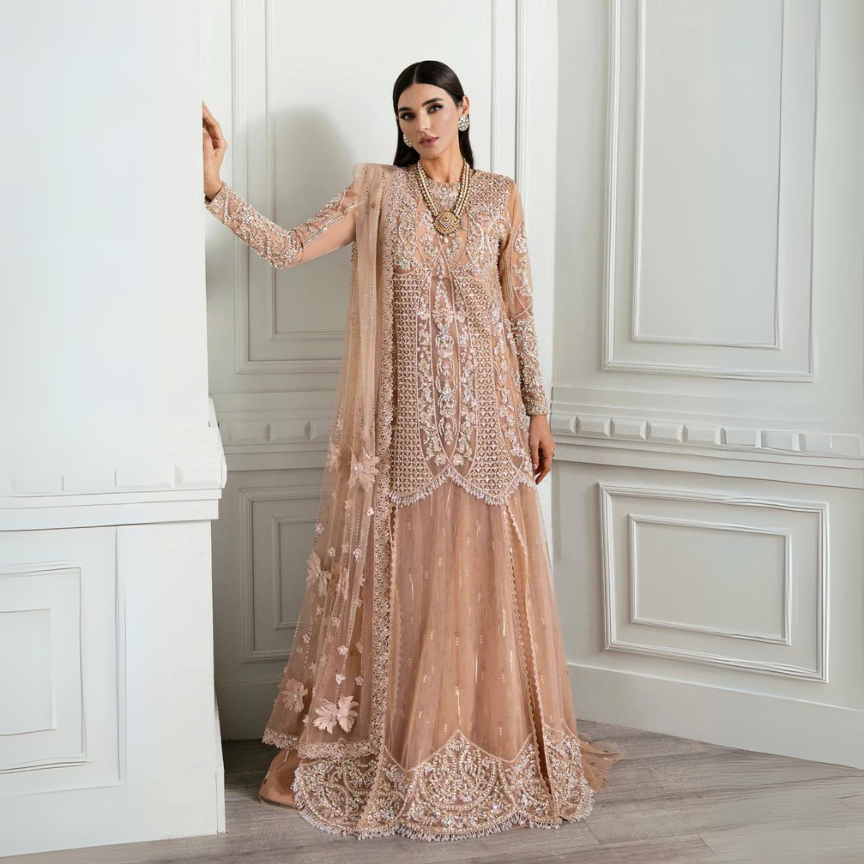 Amna Babar wearing Crimson by Saira Shakira Stardust peach net formal dress with intricate silver and champagne embroidery
