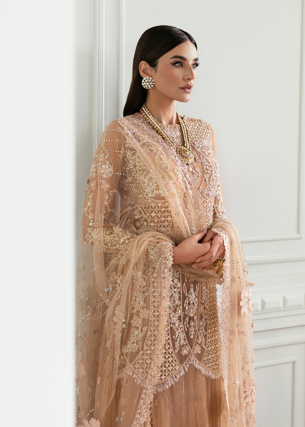 Amna Babar modelling Crimson by Saira Shakira Stardust luxury peach Pakistani designer formal outfit with embroidered net sleeves