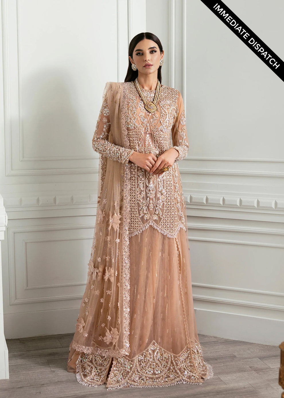 Crimson Stardust coordinating soft peach sheer net dupatta styled with an intricately embroidered Pakistani formal outfit