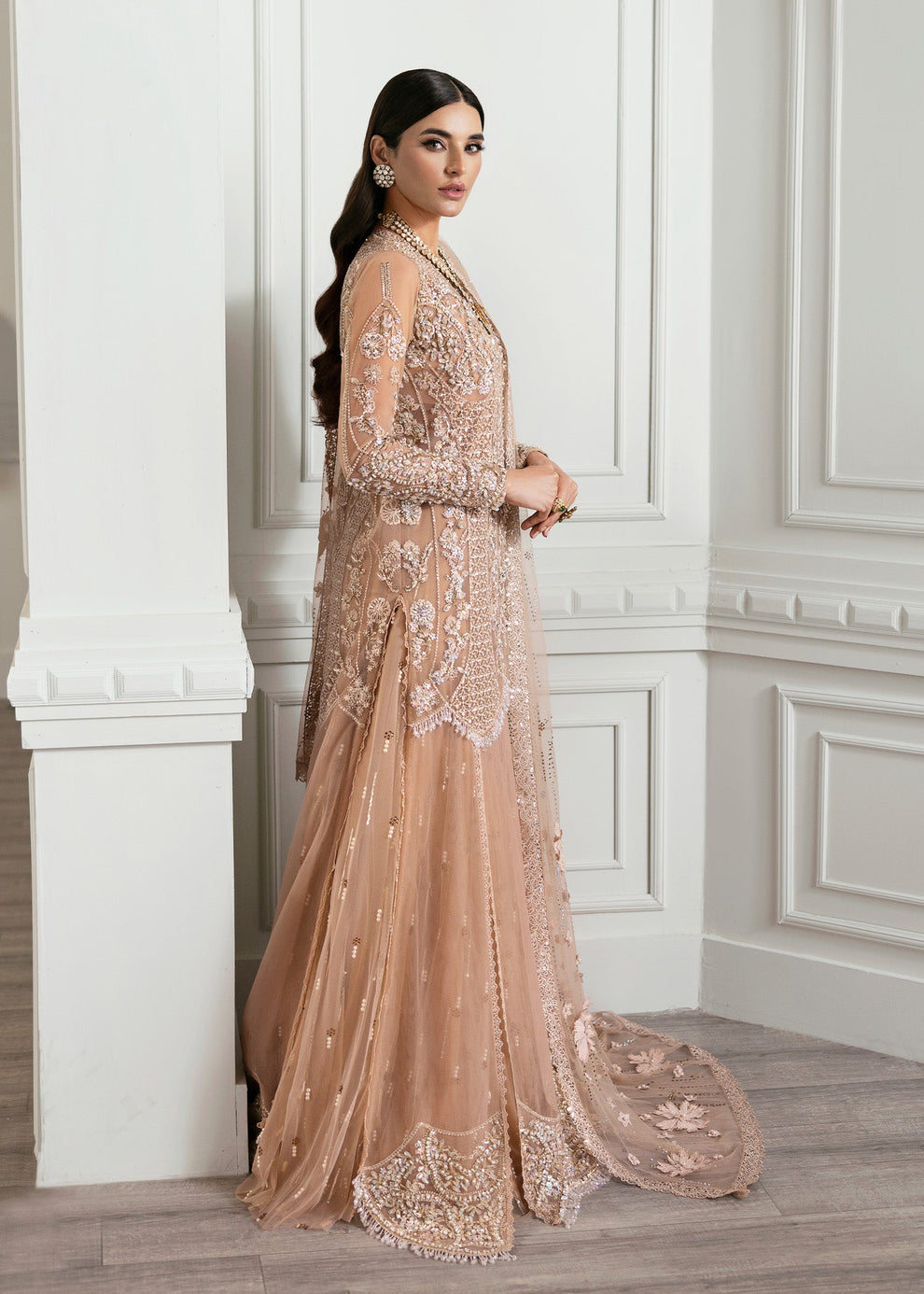 Close-up of intricate silver and champagne gold ornamental embroidery on Crimson by Saira Shakira Stardust net formal dress