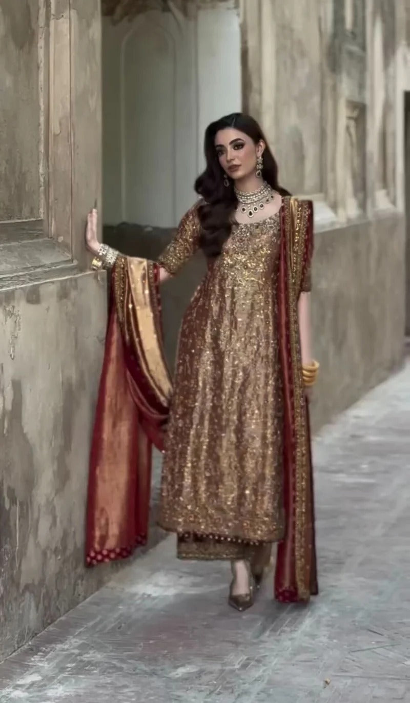 Haris Shakeel Meerub luxury antique gold shirt featuring intricate floral embroidery and embellished neckline at Zenni’s Atelier
