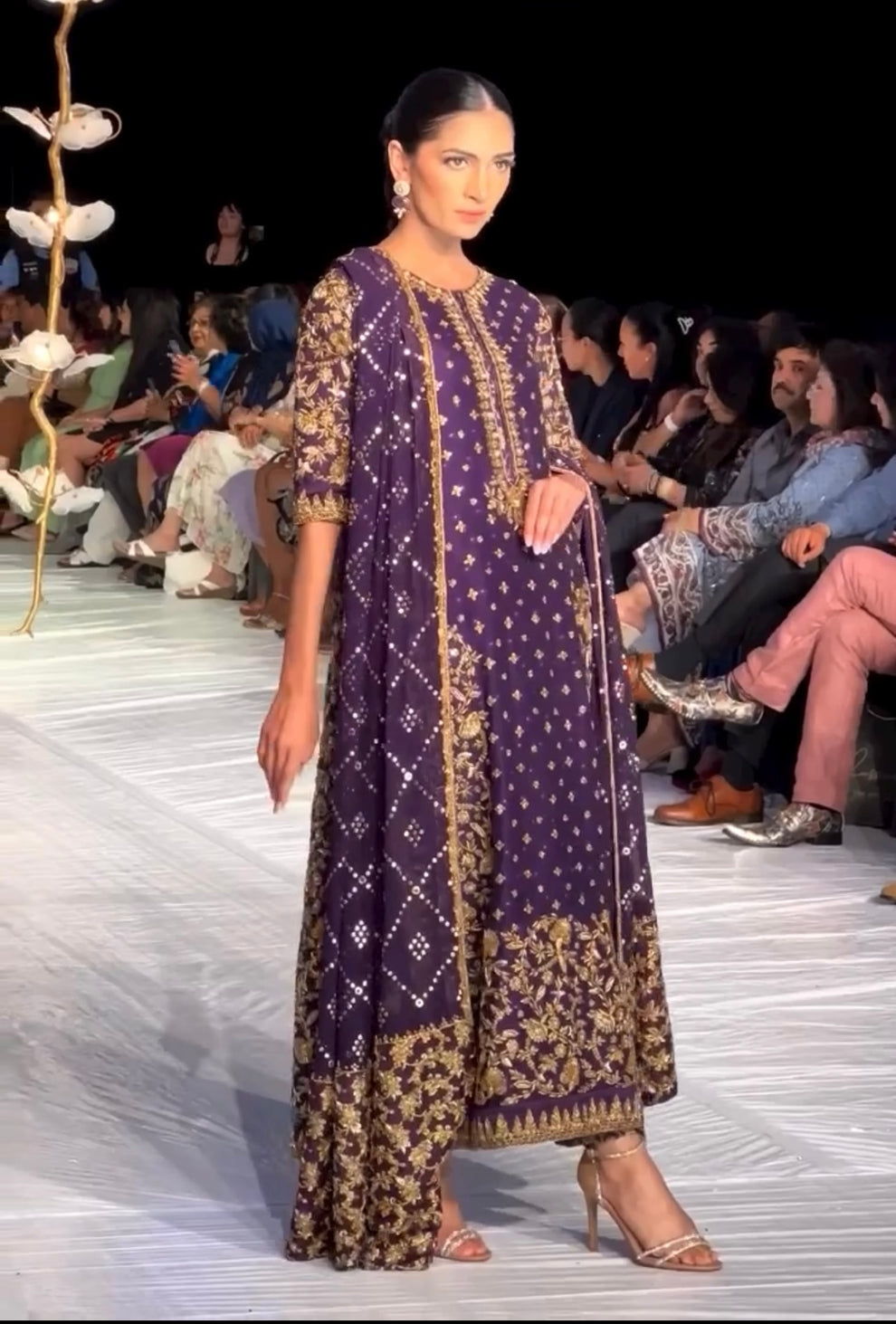 Haris Shakeel Brides Purple luxury Pakistani formal outfit featuring royal purple fabric and gold floral embroidery