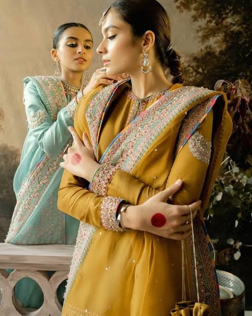 Hussain Rehar Arasti wide-leg mustard trousers with intricate floral embroidery and ornate borders at Zenni’s Atelier