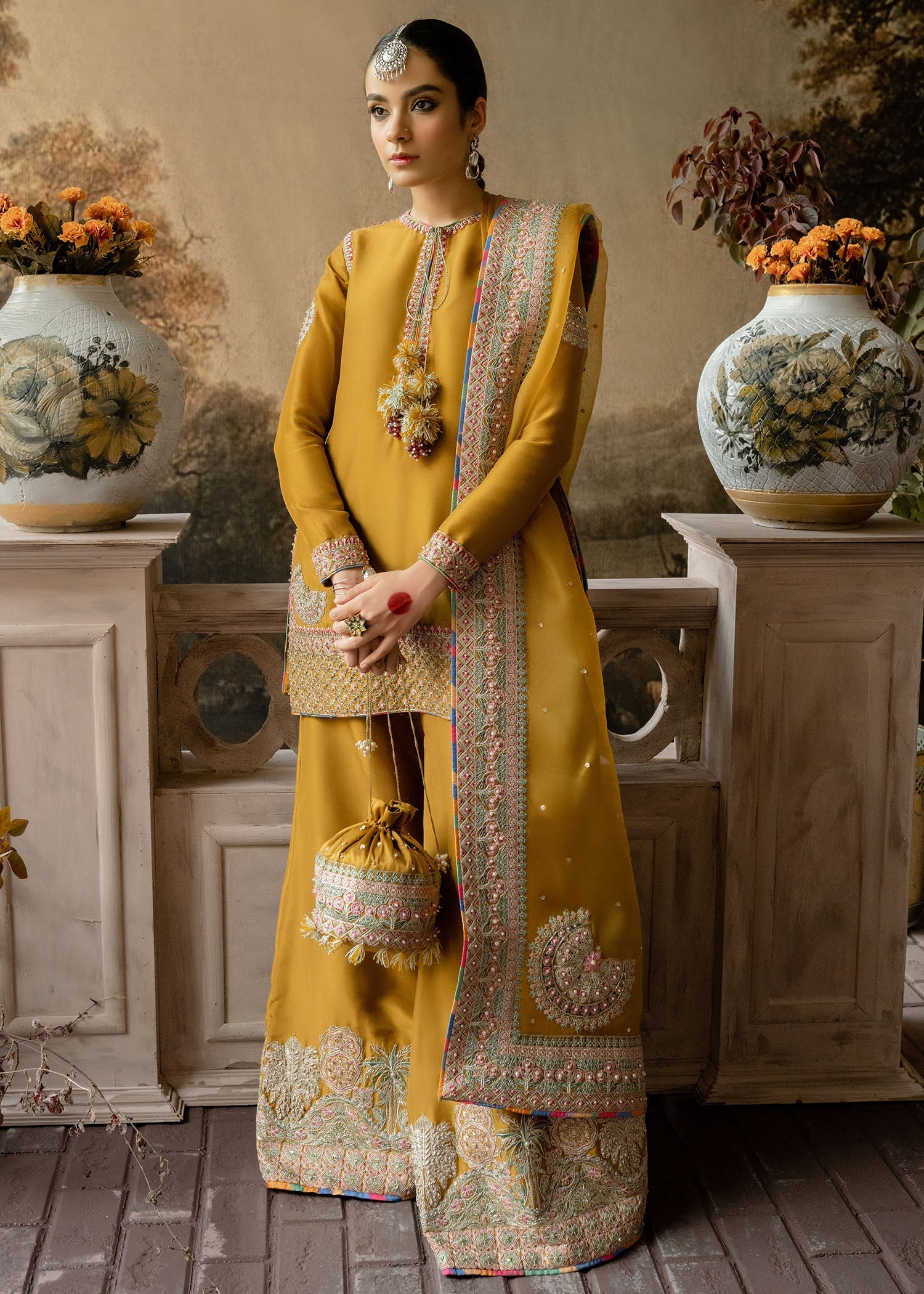 Hussain Rehar Arasti mustard raw silk shirt with delicate pastel embroidery and decorative neckline tassels at Zenni’s Atelier