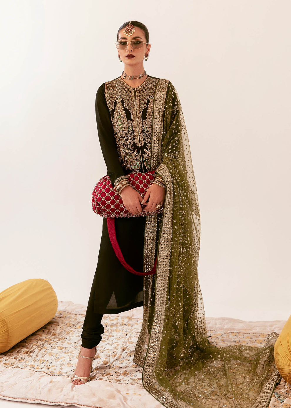 Close-up of antique gold and sage-green ornamental embroidery on Hussain Rehar Darya raw silk shirt