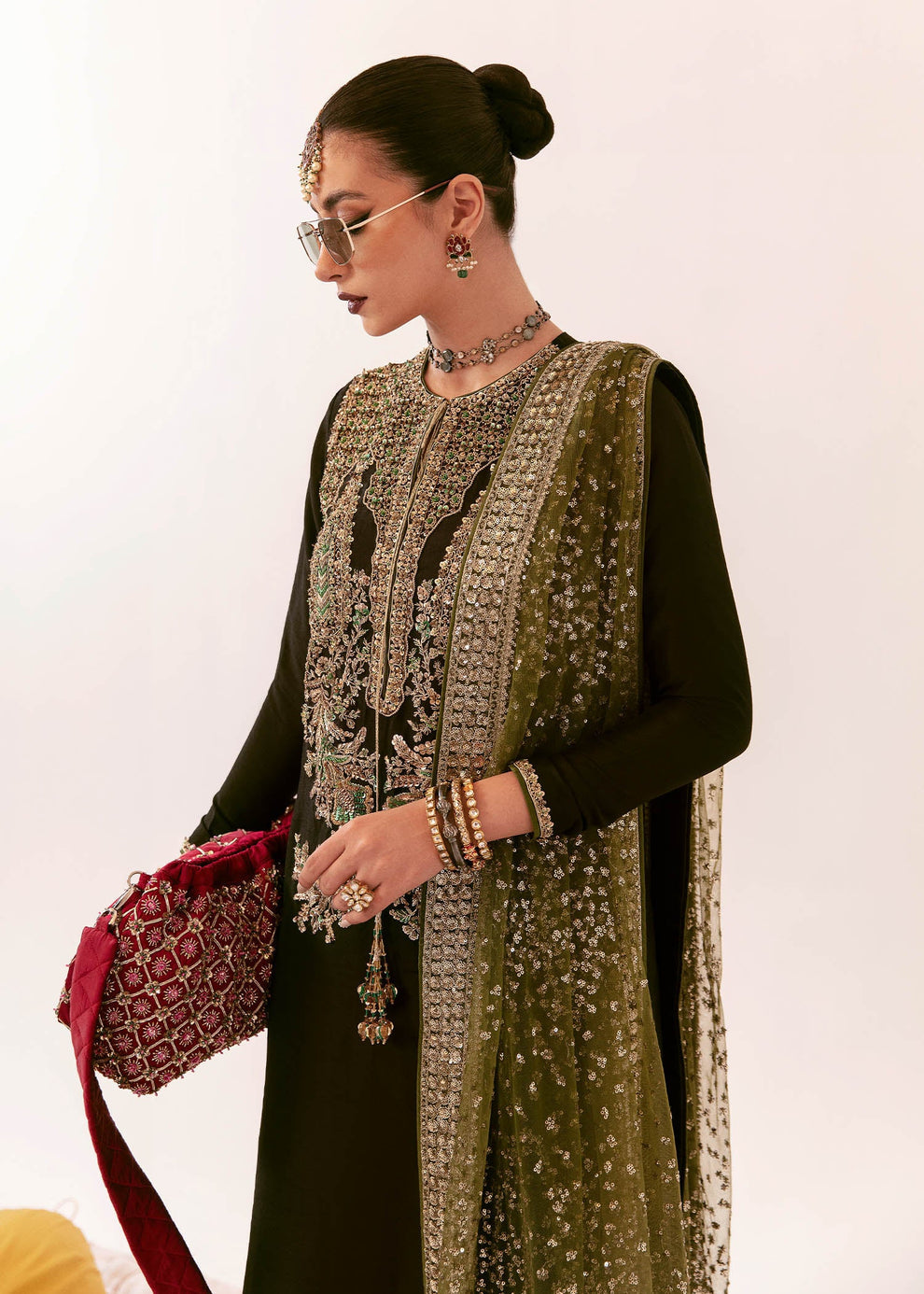 Kiran Malik modelling Hussain Rehar Darya dark olive luxury Pakistani designer formal ensemble
