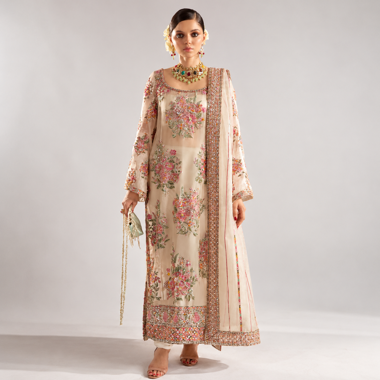 Moorak Amin wearing Hussain Rehar EURU ivory organza dress with pink floral embroidery