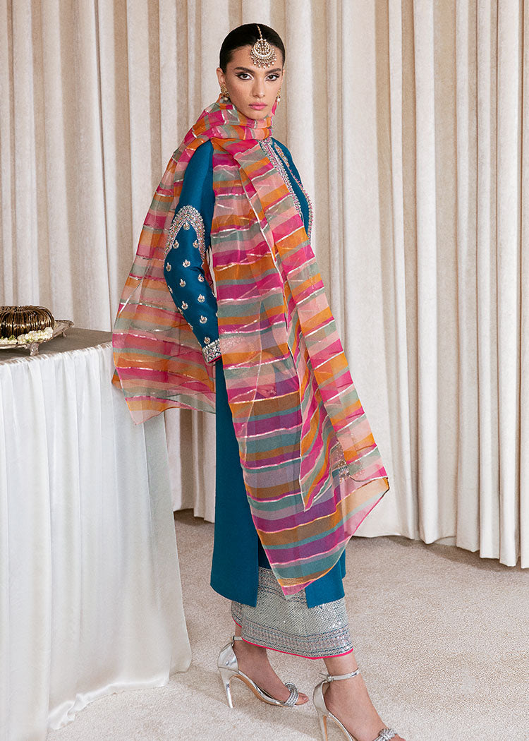 Close-up of intricate pink coral and mint green floral embroidery on Hussain Rehar Gelid peacock blue raw silk shirt