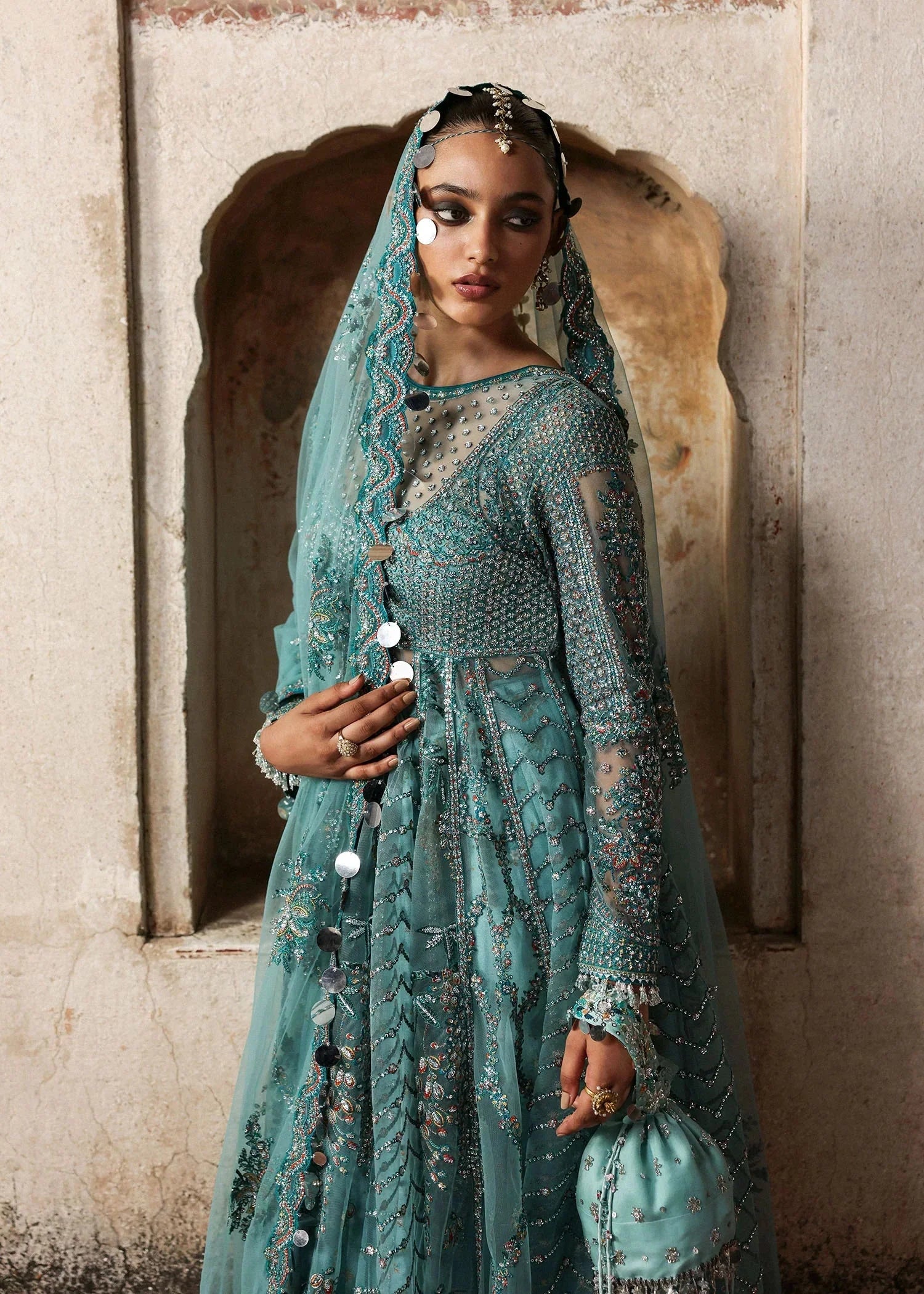 Hussain Rehar Nagma matching teal net dupatta with embroidered borders and decorative circular accents at Zenni’s Atelier