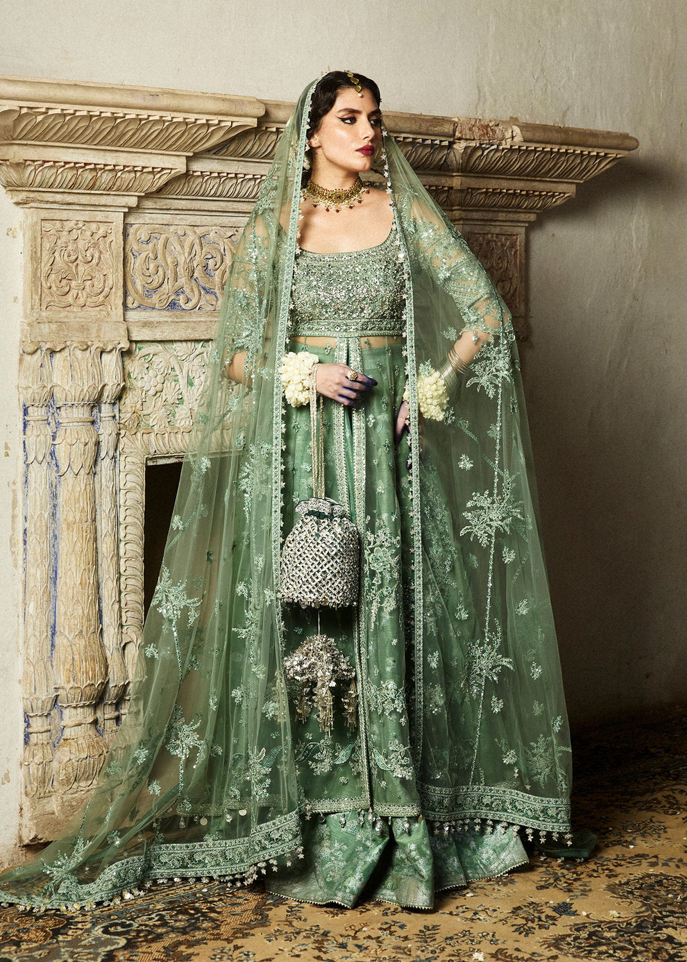 Full-length Hussain Rehar Parag sage green raw silk lehenga choli with delicate floral embroidery