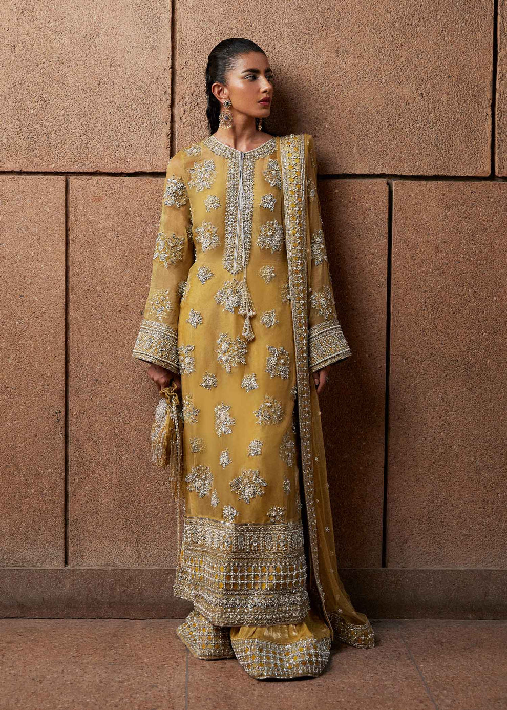 Alina Khan wearing Hussain Rehar Zesty mustard gold designer wedding guest outfit
