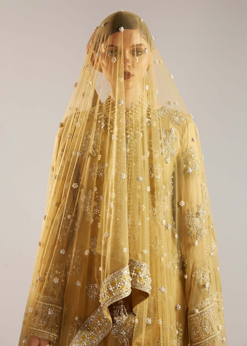 Close-up of silver-toned floral embroidery on Hussain Rehar Zesty organza dress