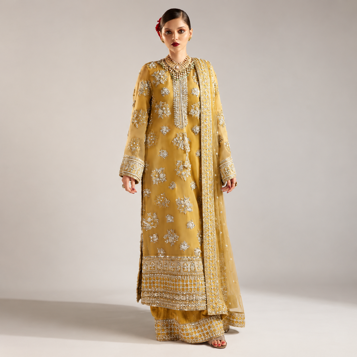 Hussain Rehar Zesty mustard gold organza formal dress front view modelled by Alina Khan
