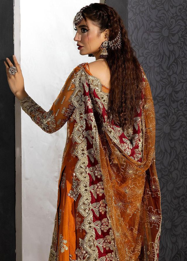 Anam Malik wearing Imrozia Premium Andaaz-e-Khaas orange embroidered Pakistani wedding guest outfit