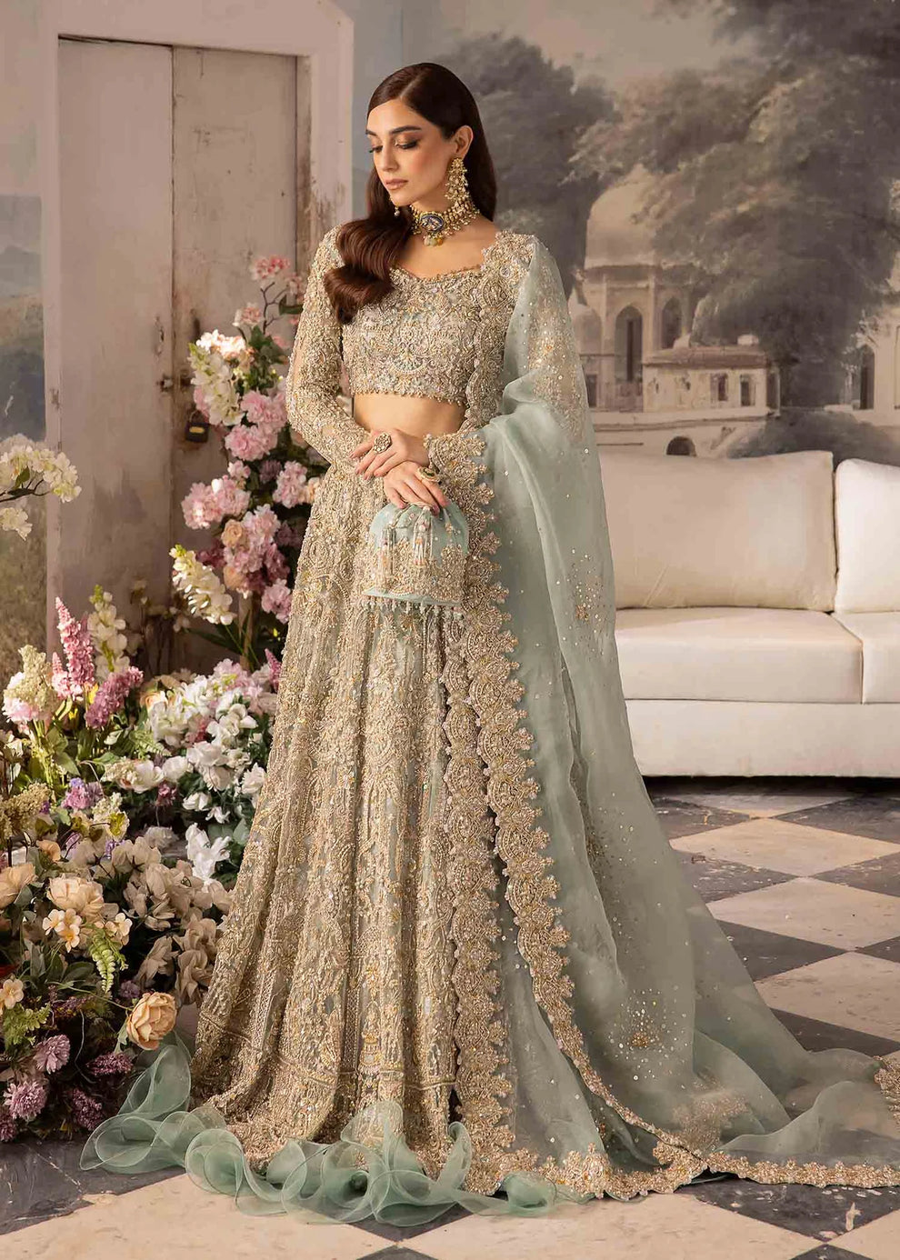 Close-up of intricate champagne gold floral embroidery on Kanwal Malik Nazra sage green organza dress