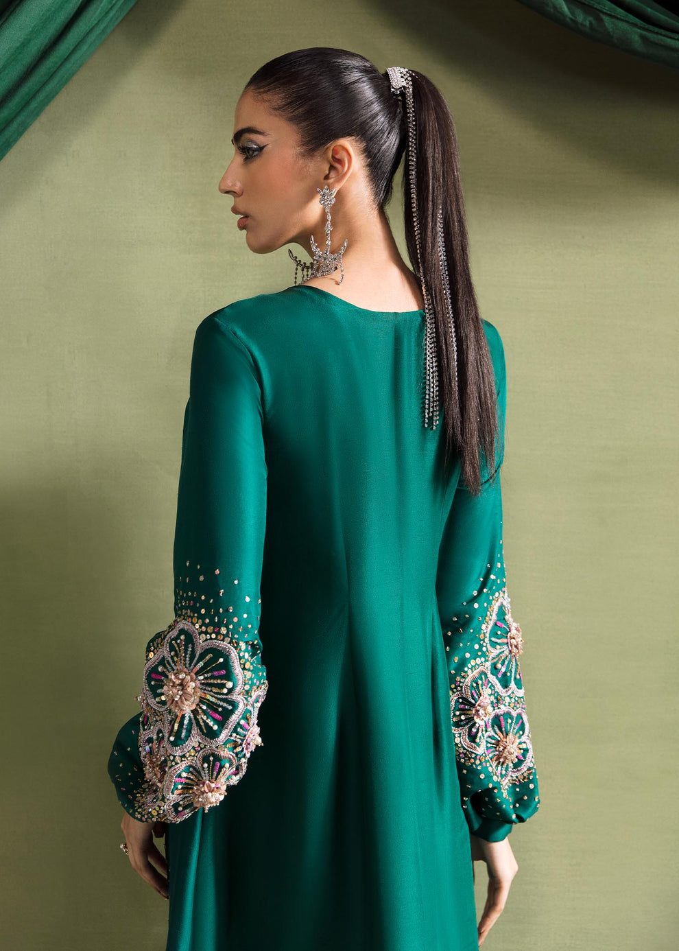Close-up of blush pink and champagne gold floral embroidery on Kanwal Malik Olivia emerald green raw silk shirt