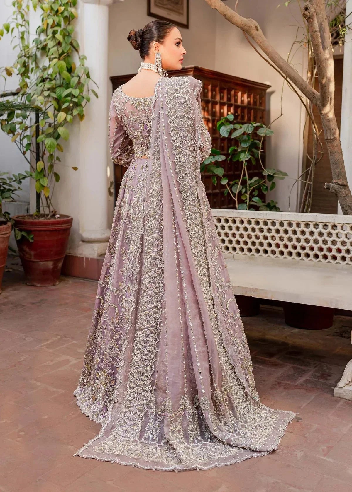 Close-up of silver and champagne floral embroidery on Kanwal Malik Zaarish lavender organza formal dress