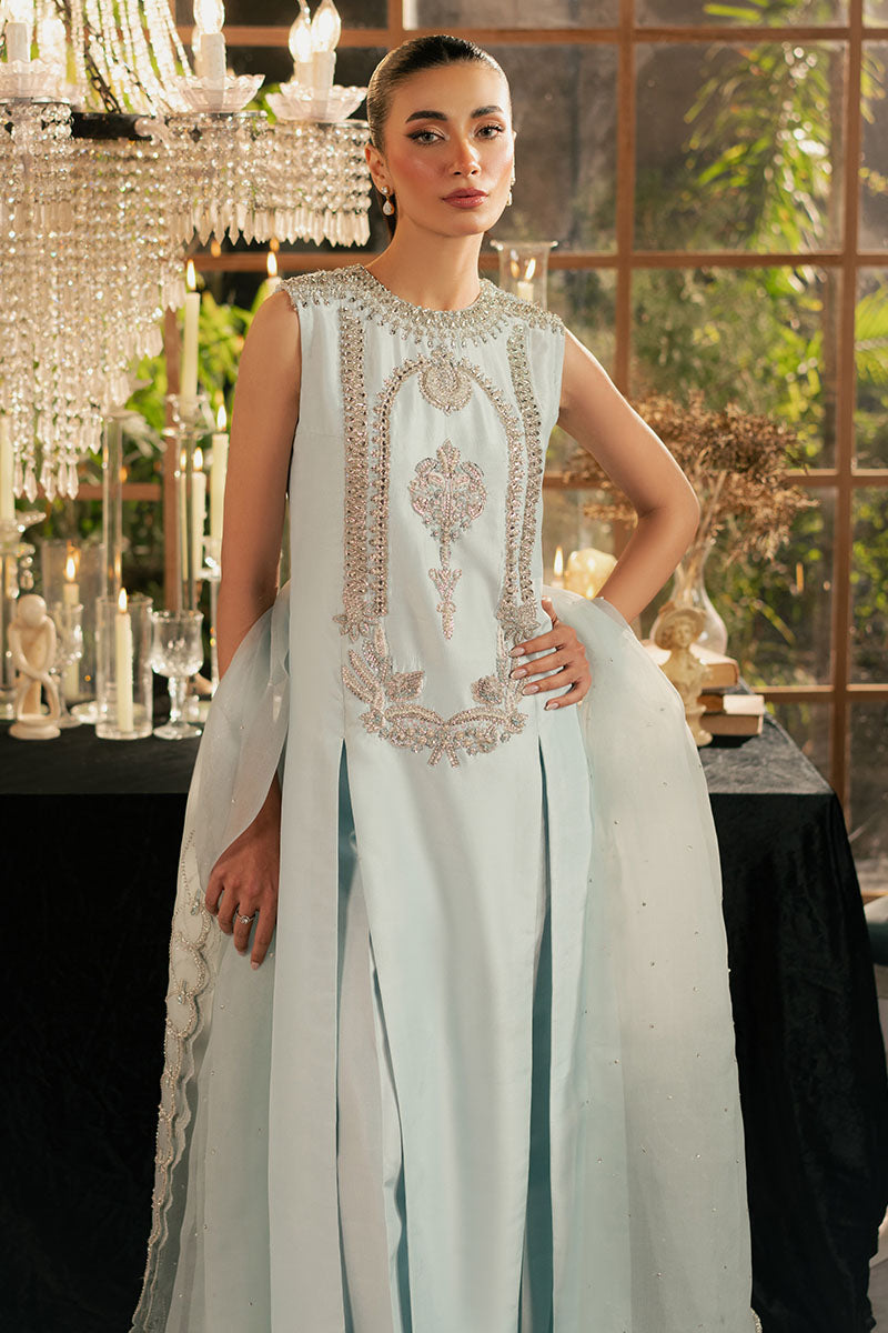 Palvasha Khalid wearing Khaaka Icelis ice blue luxury Pakistani formal dress with a coordinating organza dupatta