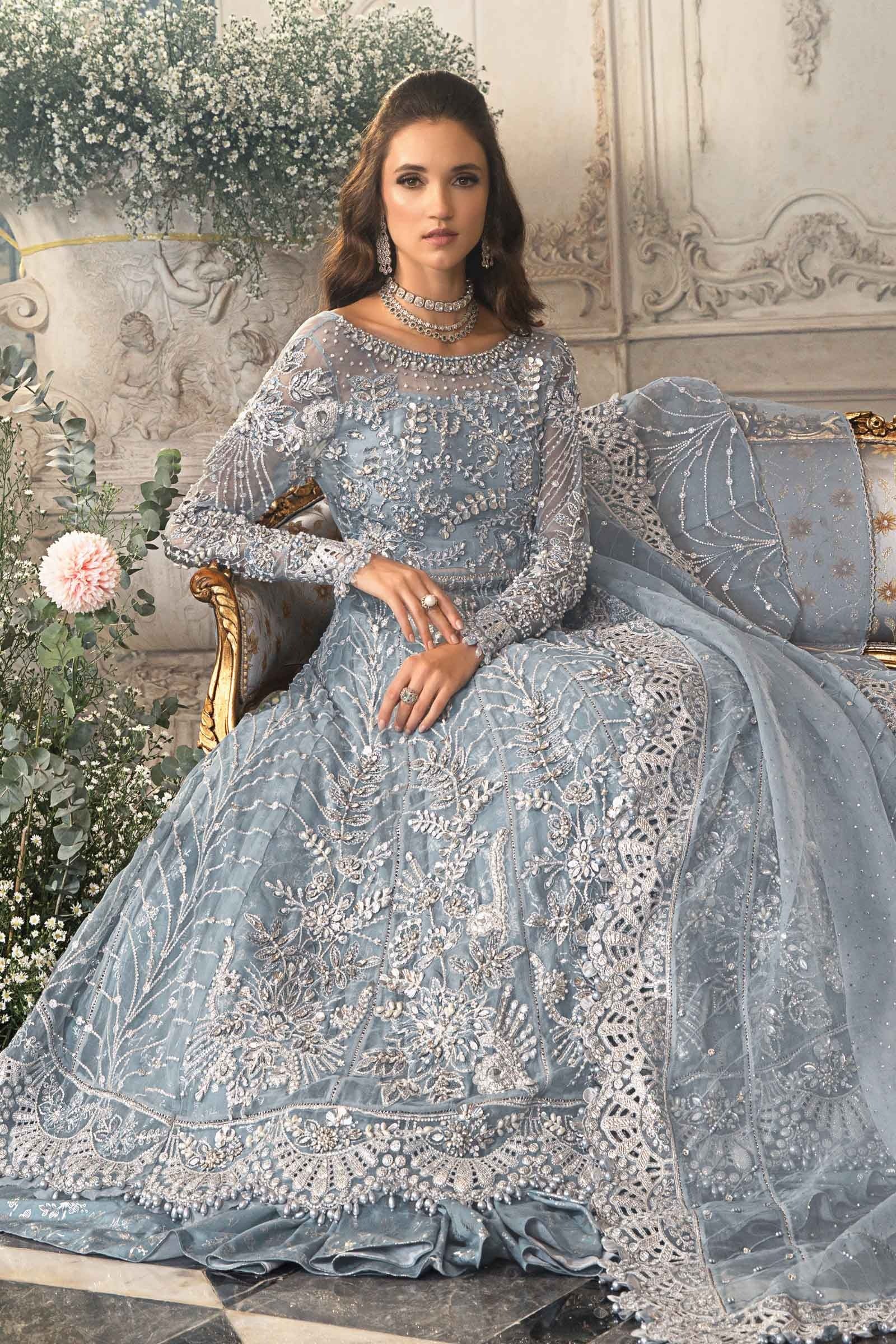 Maria.B Bridal D-2 ice blue maxi featuring intricate silver floral embroidery and embellished neckline at Zenni’s Atelier