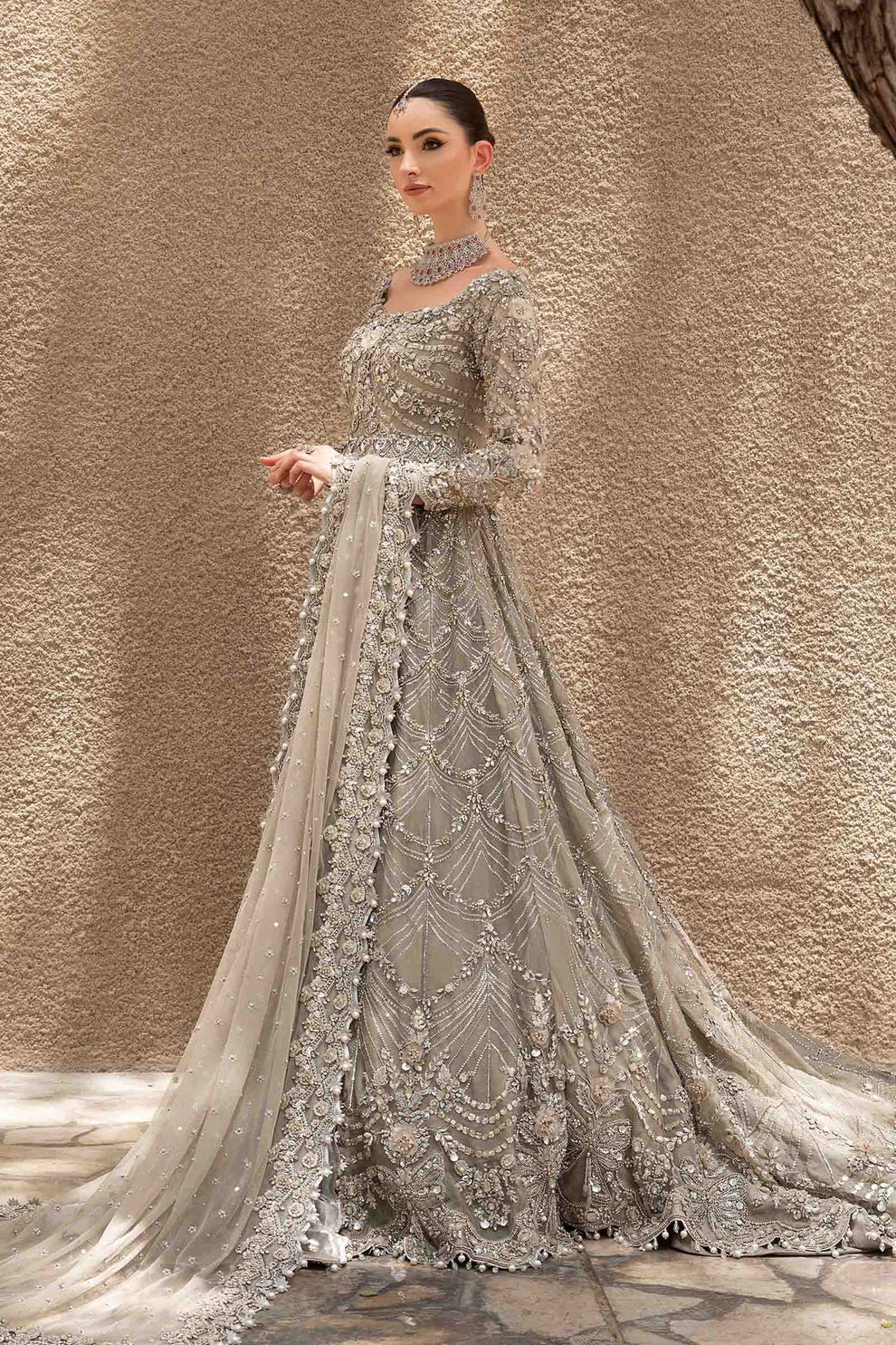 Close-up of intricate three-dimensional floral embellishments on Maria.B Brides Izumi silver-grey net shirt