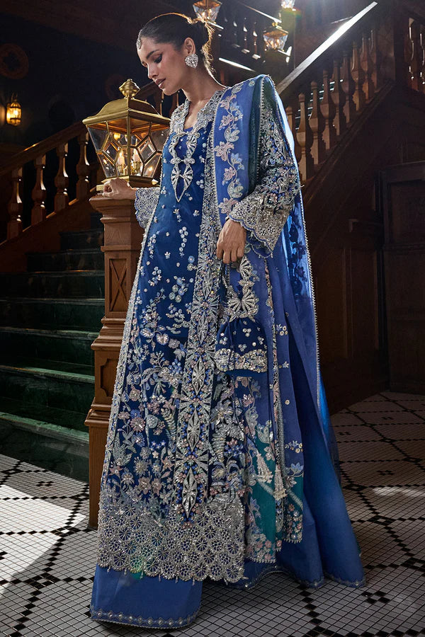 Close-up of silver and ivory floral embroidery on Soraya Elise royal blue net festive dress