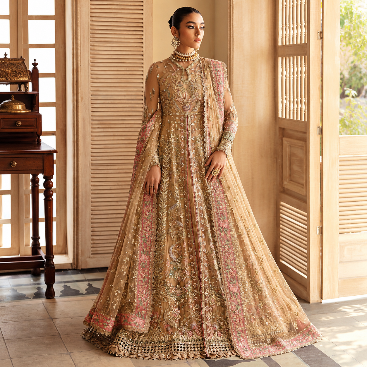 Rooshan Khan wearing Soraya Irina champagne gold organza dress with intricate floral embroidery